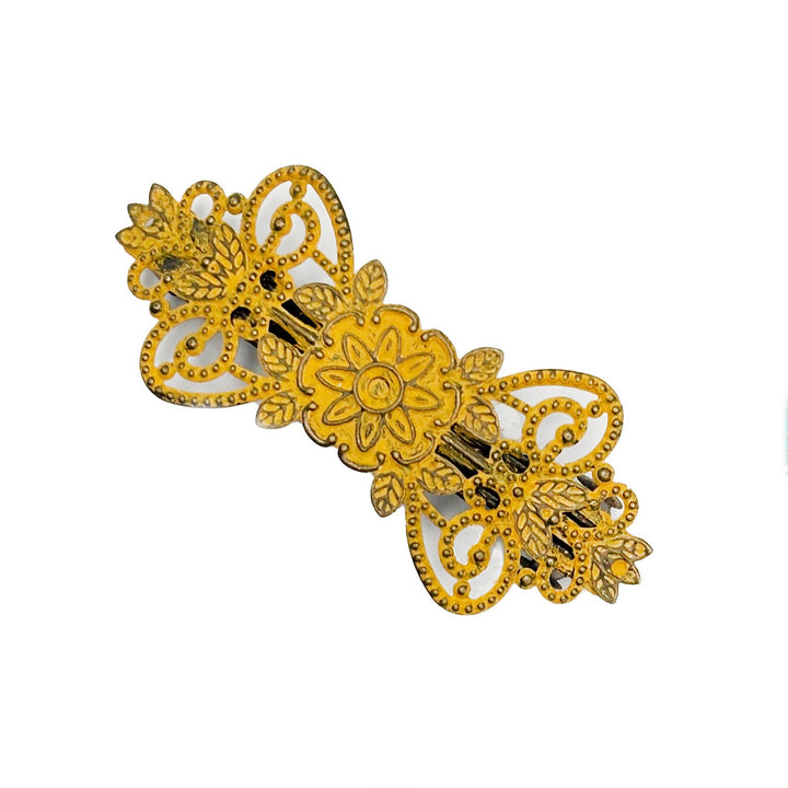 Antique bronze filigree barrette with a flower, vines and leaves. Hand-painted mustard yellow and burnished to shiny gold.