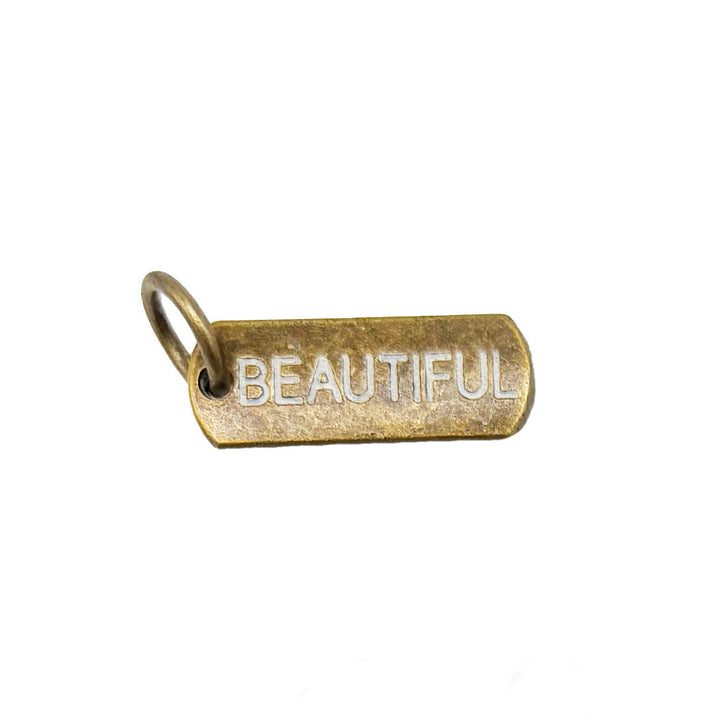 Empowering words tag charm, hand-painted by artisans in Denver, CO, available as a charm on card, bracelet, or necklace, hypoallergenic and lead-free, 3/4” long.