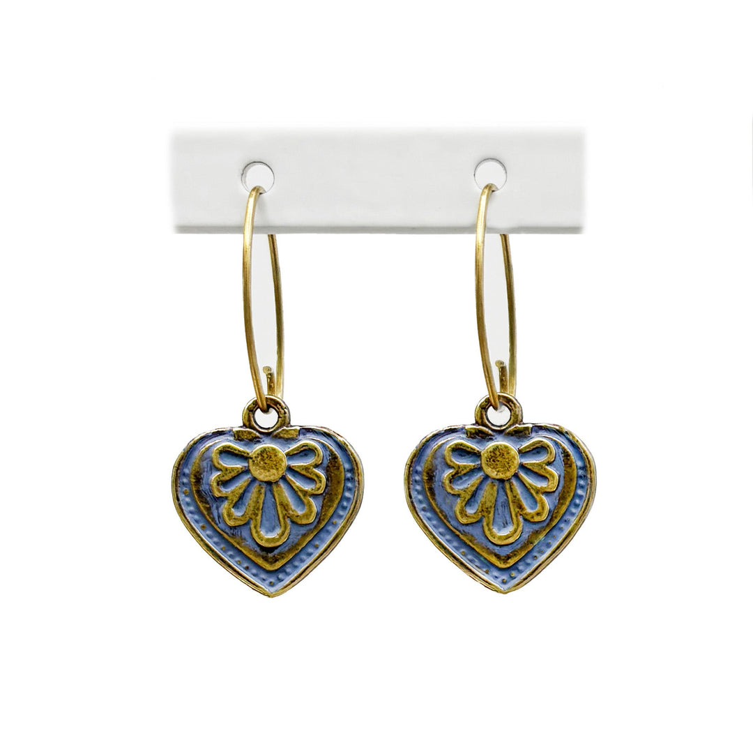 Antique bronze charms painted blue gray and burnished to shiny gold. on 1" gold ear loops. Graphic details mimic a blooming flower.