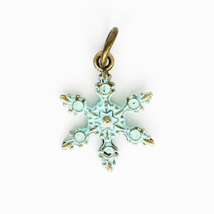 Snowflake Charm - Hand-painted, hypoallergenic, 3/4" long, available as charm on card, bracelet, or necklace.