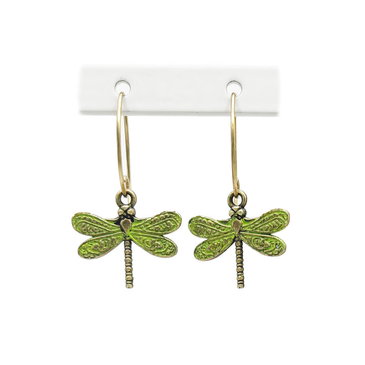 Hand-painted dragonfly charm earrings symbolizing transformation and personal growth, crafted by artisans in Denver, CO. Hypoallergenic, lead-free, and nickel-free.