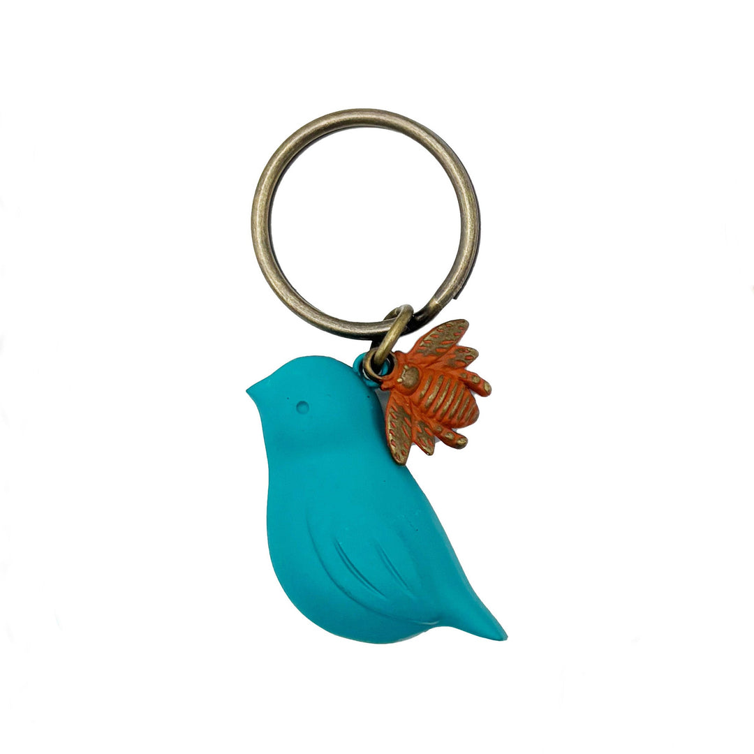 Antique bronze 1 1/2" bird charm with small bee charm keychain on 1 1/4" keyring. Turquoise bird with red bee charm.