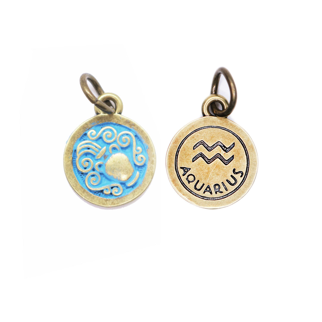Brass-tone Aquarius zodiac charm painted bright blue. One side depicts an urn overflowing with water. Reverse side shows the water sign and says "AQUARIUS".