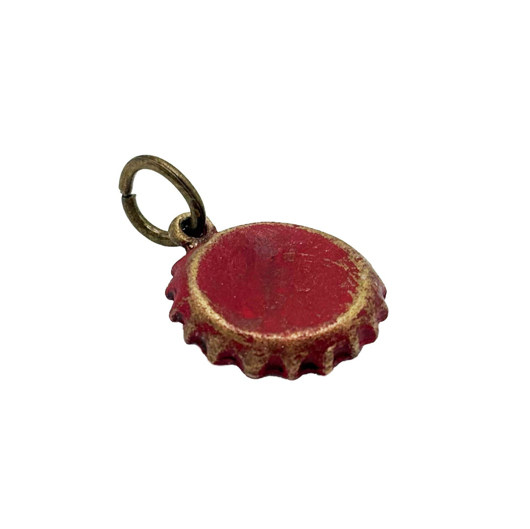 Antique bronze bottle cap charm is painted red and burnished until shiny. Charm comes with jump ring. Vintage style.