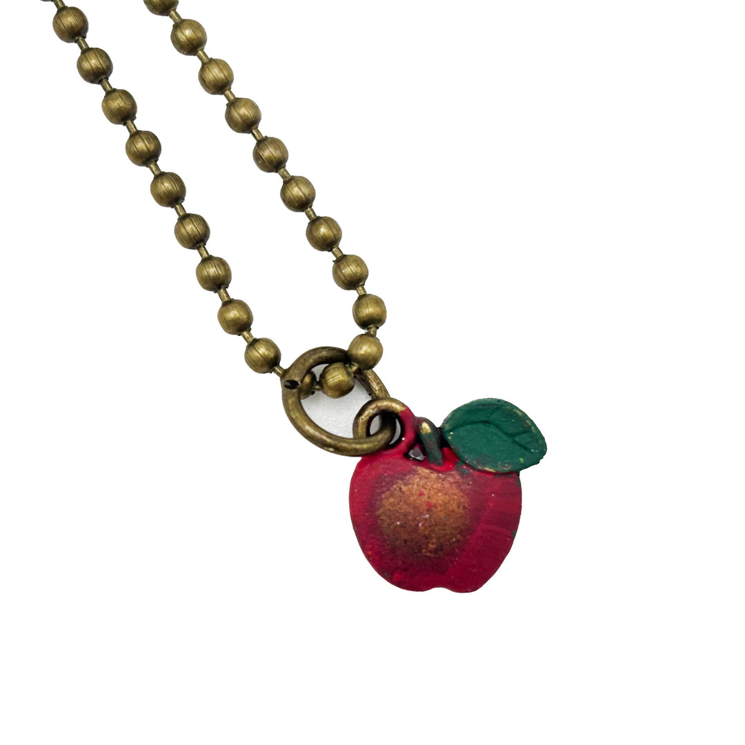 Antique bronze apple charm painted red with a green leaf and burnished to shiny gold. Shown with 18" antique bronze ball chain.
