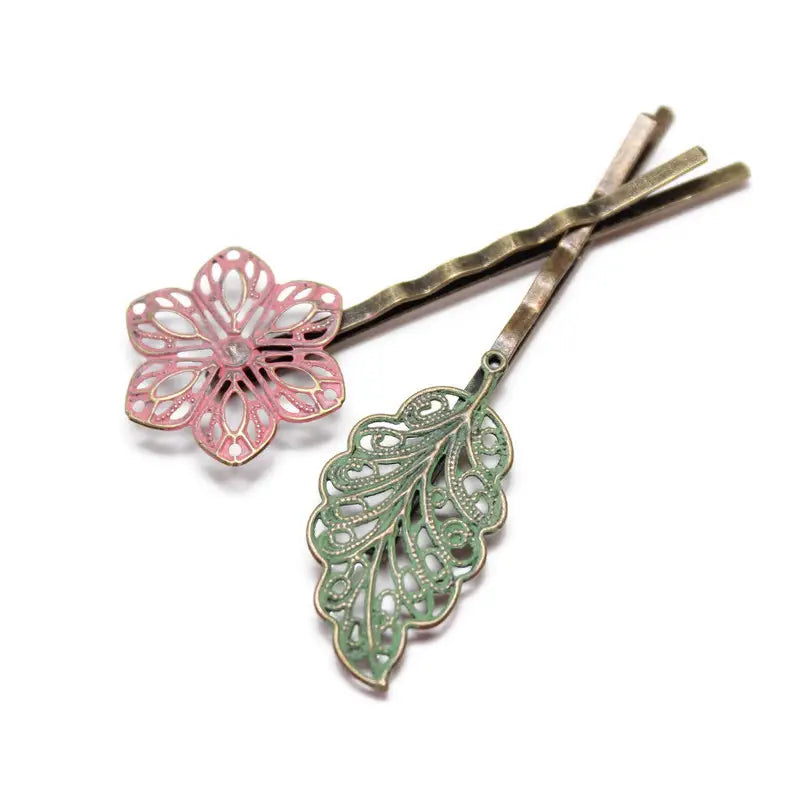 Bohemian mismatched bobby pin duo with filigree leaf and flower, hand-painted in Denver, CO, hypoallergenic.