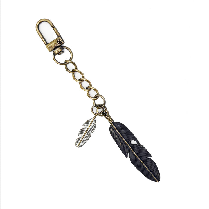 Hand-painted feather bag charm and keychain with lobster claw, 5-inch length, hypoallergenic, made in Denver, CO.