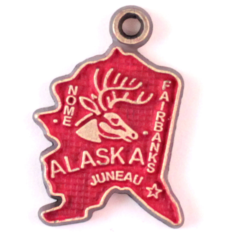 Antique bronze Alaska state charm painted red and burnished to shiny gold. Map depicts location of Nome, Juneau and Fairbanks and shows a large deer stag.