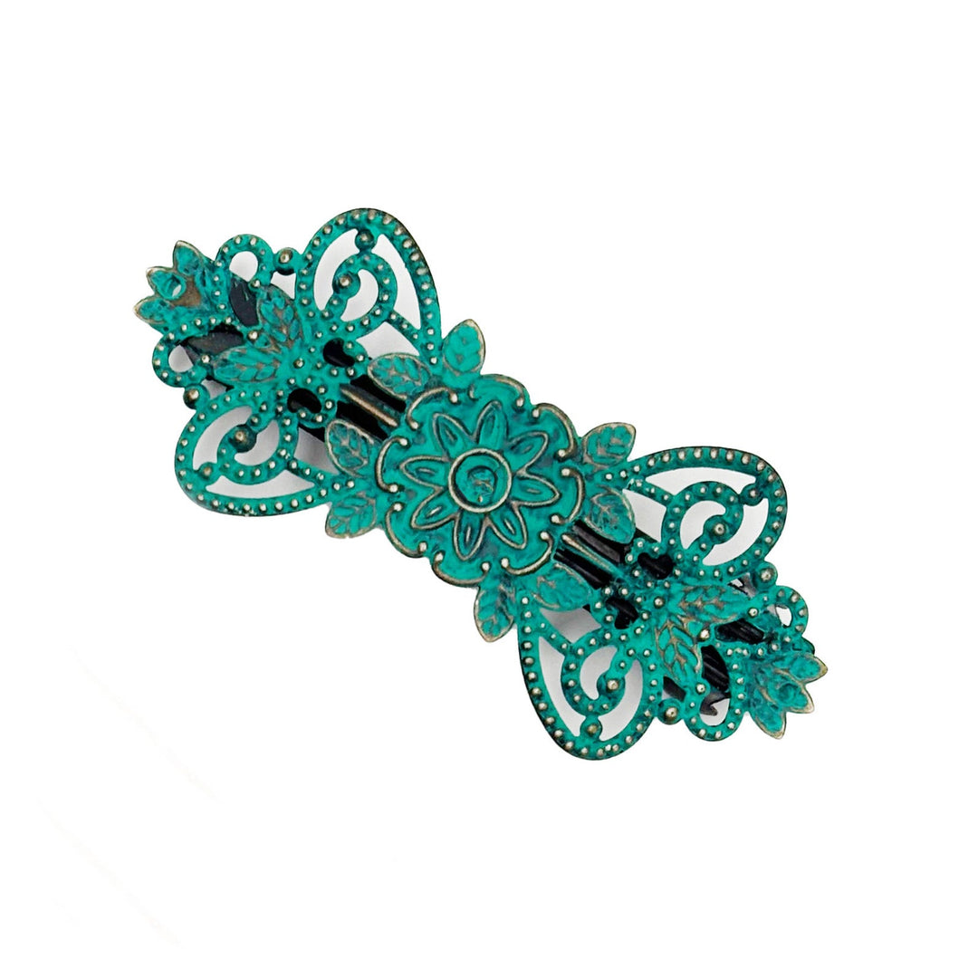 Antique bronze filigree barrette with a flower, vines and leaves. Hand-painted teal and burnished to shiny gold.