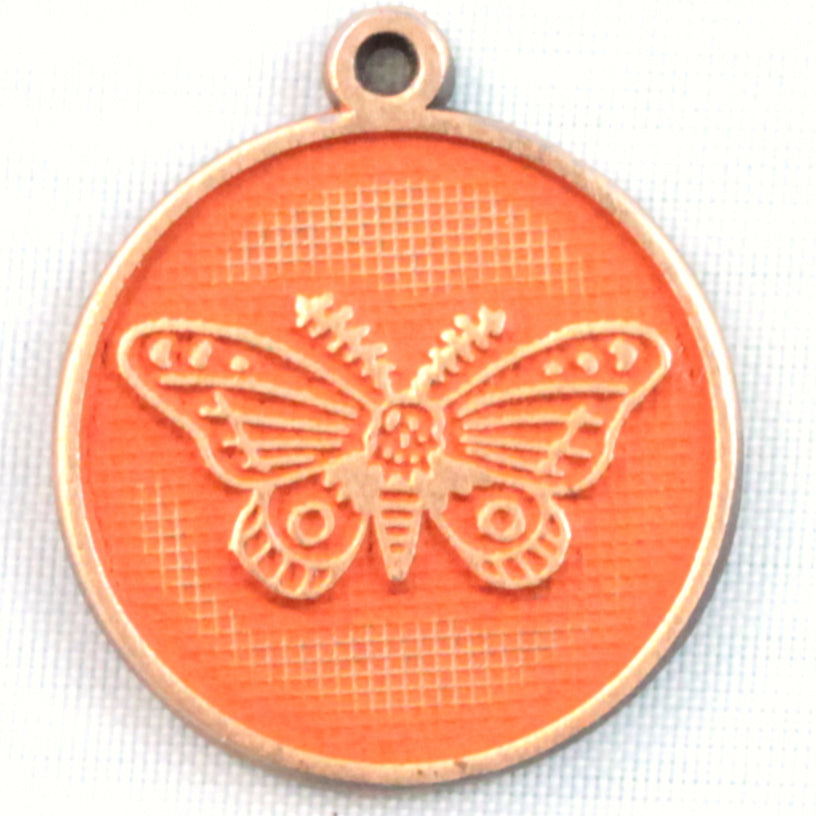 Antique bronze charm painted rustic orange and burnished to shiny gold. One side depicts a whimsical moth. Reverse side says "Always find the light".