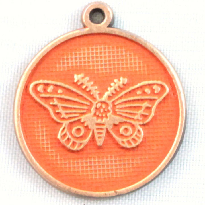 Antique bronze charm painted rustic orange and burnished to shiny gold. One side depicts a whimsical moth. Reverse side says "Always find the light".