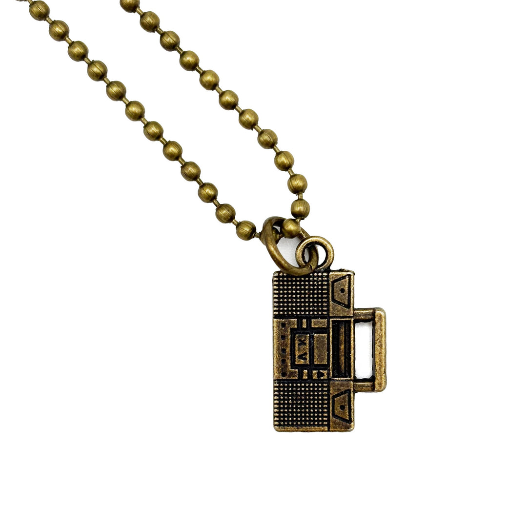 Retro boombox charm painted black and burnished to bright gold. Shown on 18" bronze ball chain.
