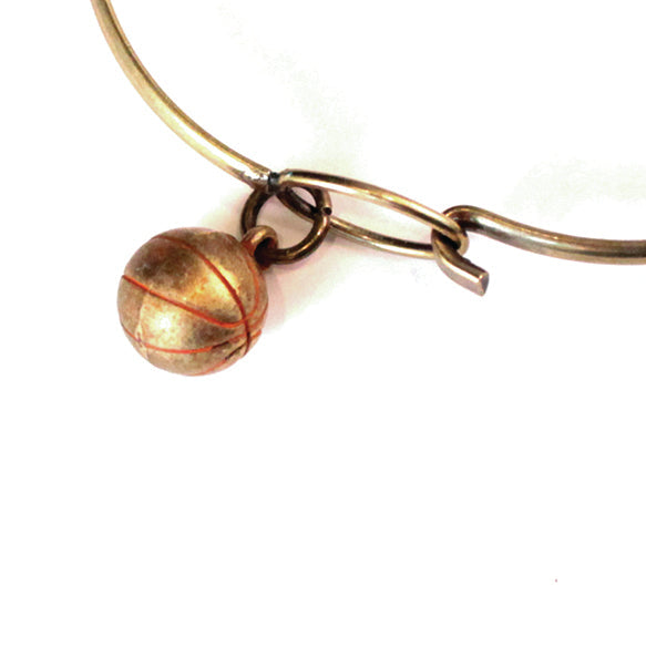 Antique bronze basketball charm painted orange with a jump ring.