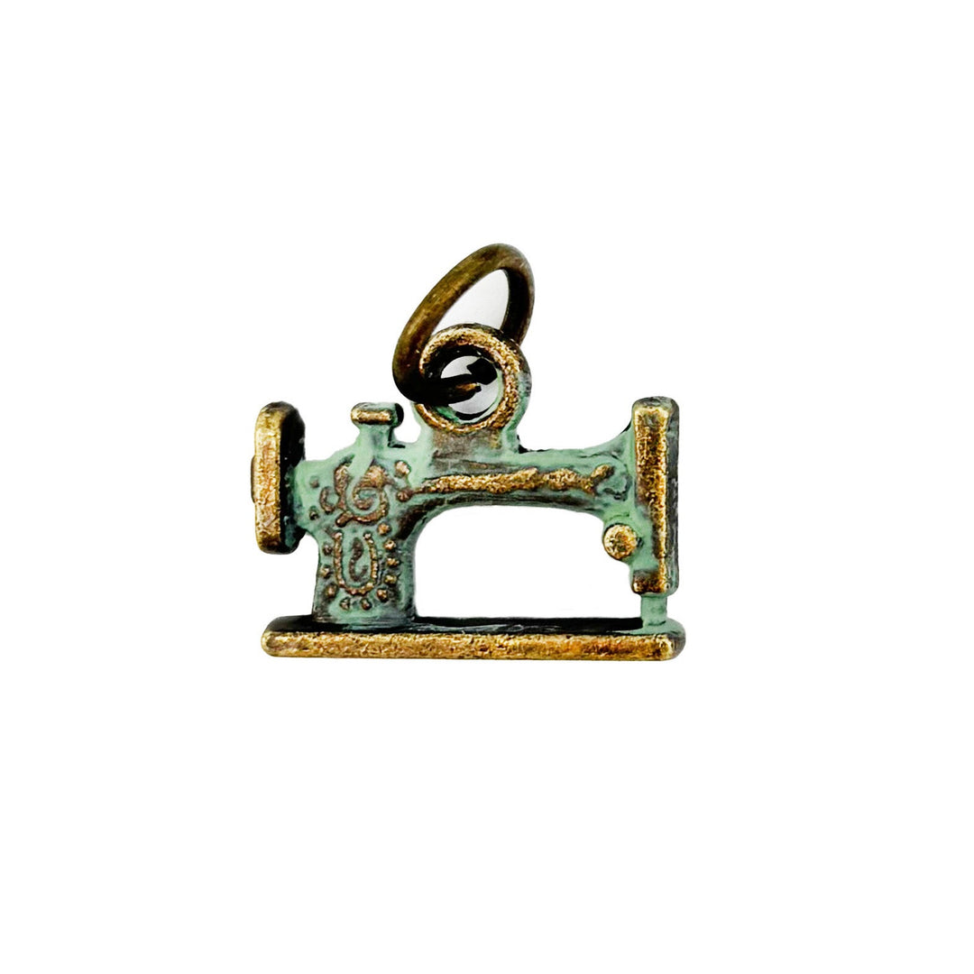 Sewing Machine Charm, 7/8” long, available as Charm on Card, Charm Bracelet (7 1/2” brass hook bangle), or Charm Necklace (18” antique bronze ball chain), hand-painted by artisans in Denver, CO, hypoallergenic, lead-free, nickel-free.