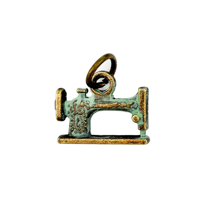 Sewing Machine Charm, 7/8” long, available as Charm on Card, Charm Bracelet (7 1/2” brass hook bangle), or Charm Necklace (18” antique bronze ball chain), hand-painted by artisans in Denver, CO, hypoallergenic, lead-free, nickel-free.