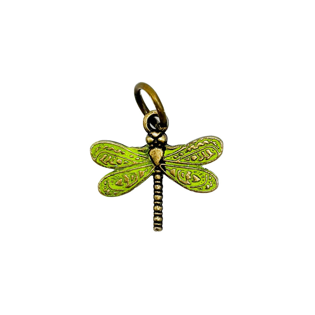 Dragonfly charm symbolizing transformation and self-realization, hand-painted by artisans in Denver, available as a charm on card, bracelet, or necklace, measuring 1", hypoallergenic and lead-free.