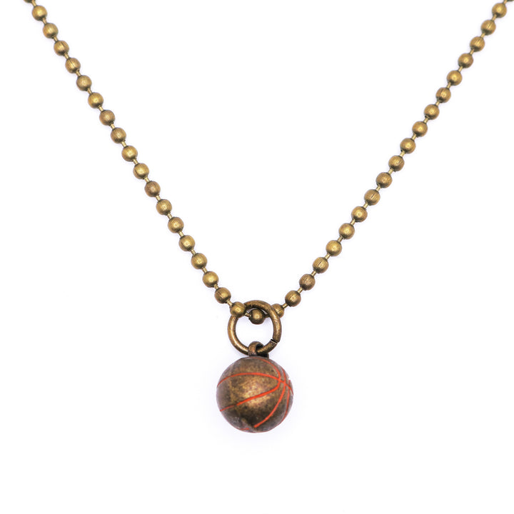 Antique bronze basketball charm painted orange with a jump ring. Shown on an 18" antique bronze ball chain.