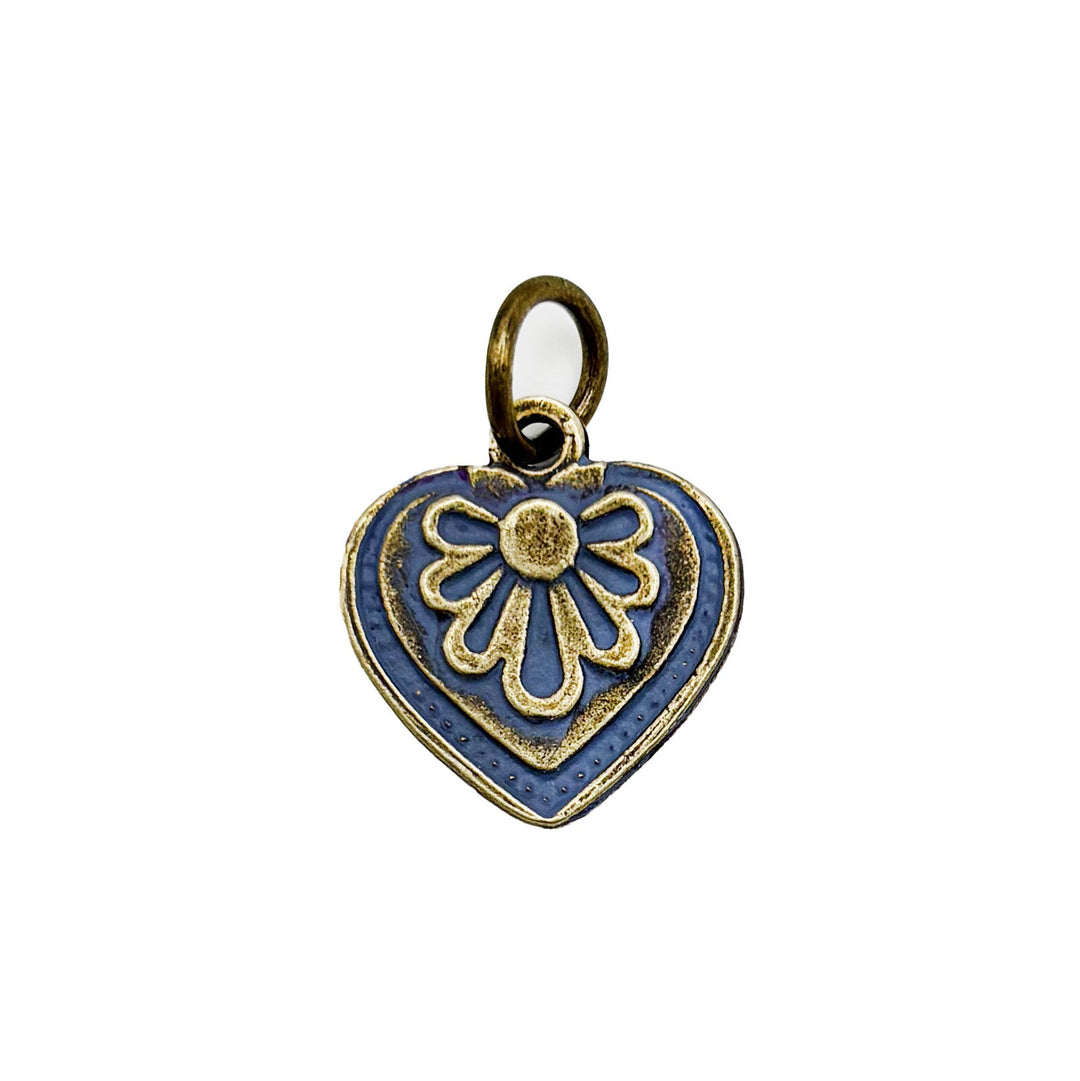 Antique bronze charm painted dark gray and burnished to shiny gold. Graphic details mimic a blooming flower. Comes with attached jump ring.