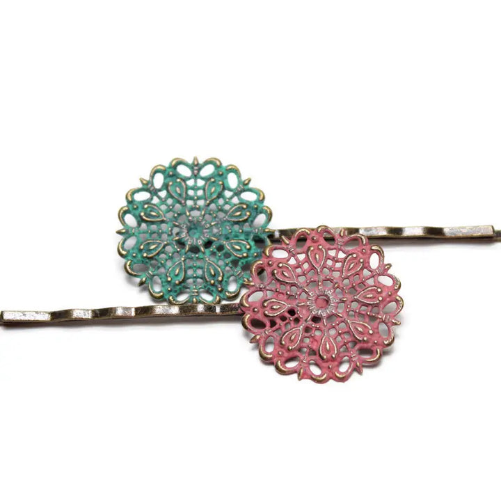 Doily-inspired filigree bobby pins in nostalgic colors, hand-painted by artisans in Denver, CO, 1-inch charms on 2 1/4-inch pins, hypoallergenic, lead-free, and nickel-free.