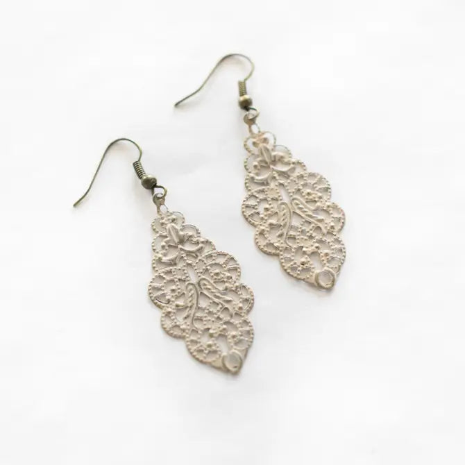 Vintage-inspired filigree earrings with intricate details, hand-painted in Denver, CO, measuring 3/4 inch wide by 1 3/4 inch long, lightweight and hypoallergenic.