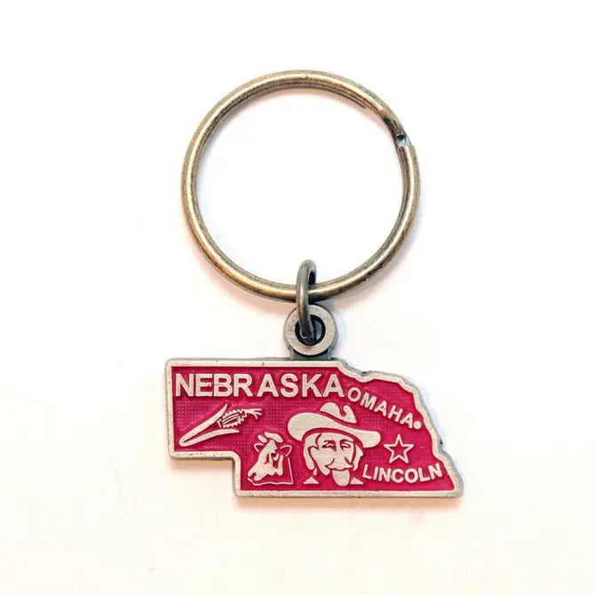 Nebraska map design keychain, representing Cornhusker State, hand-painted charm, 1 3/8” long, bronze keychain, hypoallergenic, lead-free, nickel-free.