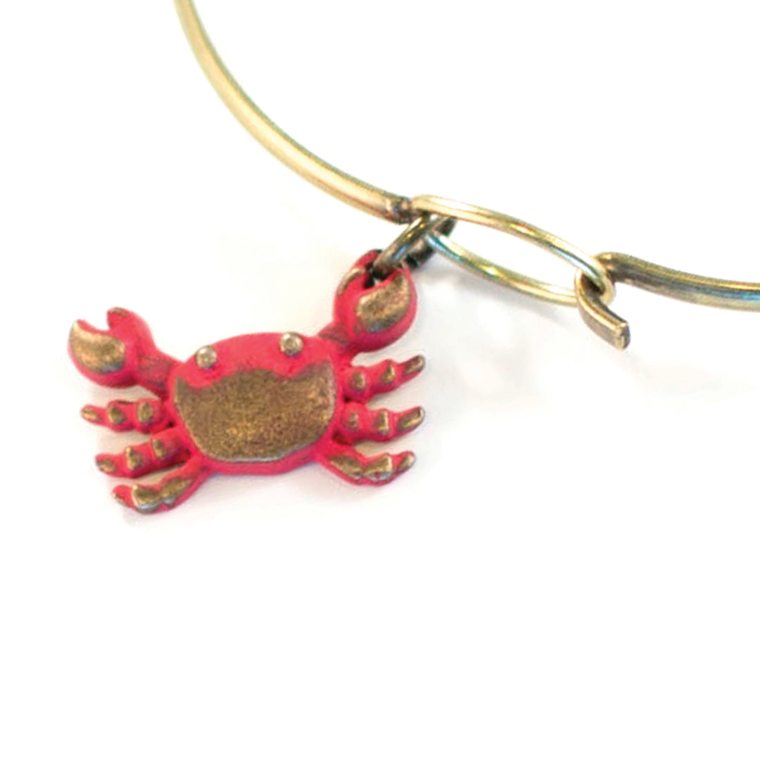 Playful Crab Charm for ocean adventures, hand-painted by artisans in Denver, available as charm on card, bracelet, or necklace, hypoallergenic and lead-free.