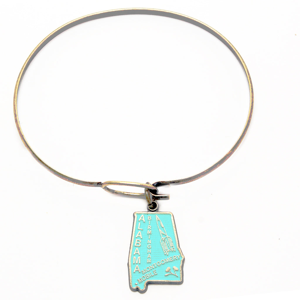 Antique bronze Alabama state charm painted turquoise and burnished to shiny gold. Map depicts location of Birmingham, Montgomery and Mobile and shows a rocket ship.