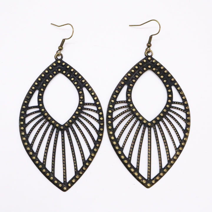 Large studded filigree charms with sweeping arcs hand-painted black. On 1" bronze ear hooks. 3 3/4" long. Art deco design.