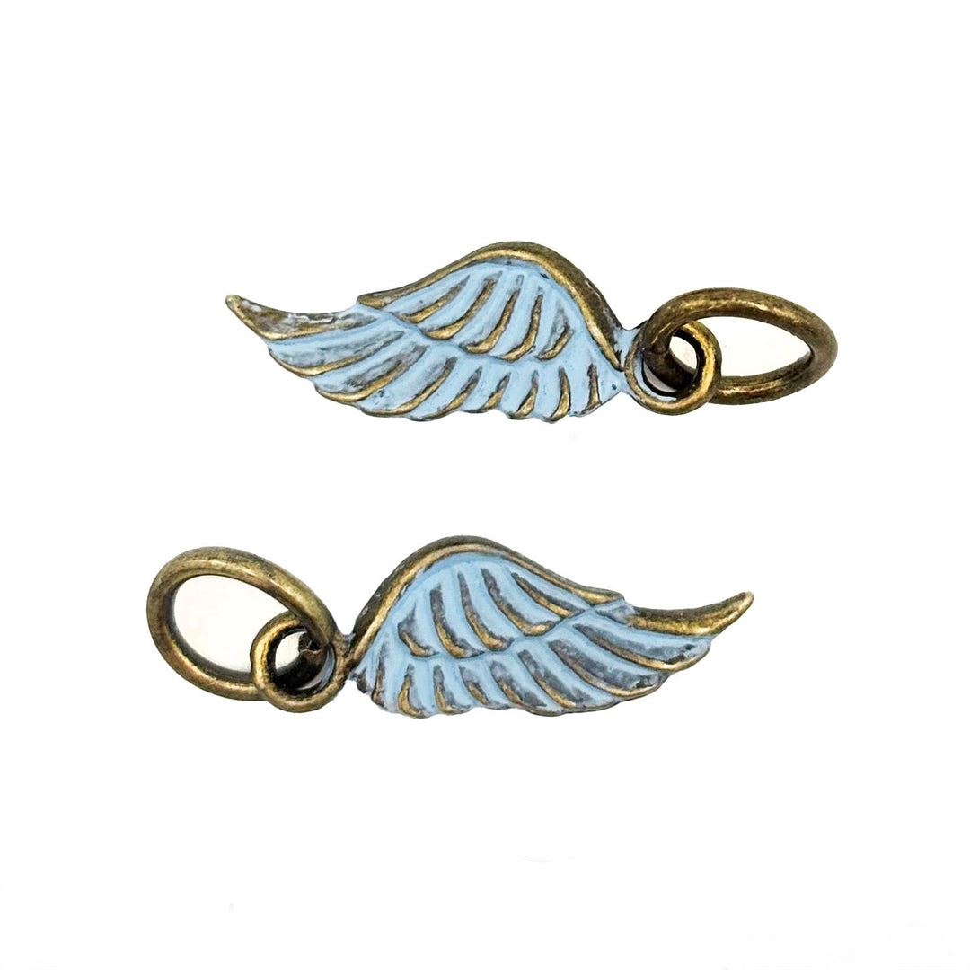 Antique bronze wing charm painted light blue and burnished to shiny gold. Charms come with attached jump ring.