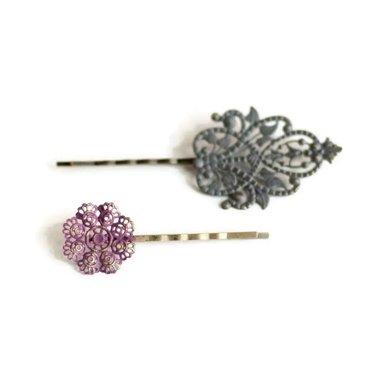Opposites Attract Filigree Bobby Pins with mismatched charms, one with lace doily, the other with intertwining vines, hand-painted, hypoallergenic, lead-free, nickel-free, 1 7/8” long charms on 2 1/4” bobby pins.