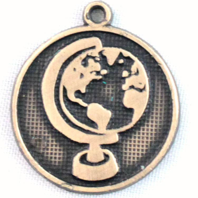 Antique bronze charm painted black and burnished to shiny gold. One side depicts a globe on it's axis. Reverse side says "Be the change you want to see".