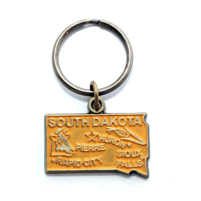 South Dakota map-shaped keychain with agricultural symbols, hand-painted, hypoallergenic, 1 3/8” charm on 1” bronze keychain.