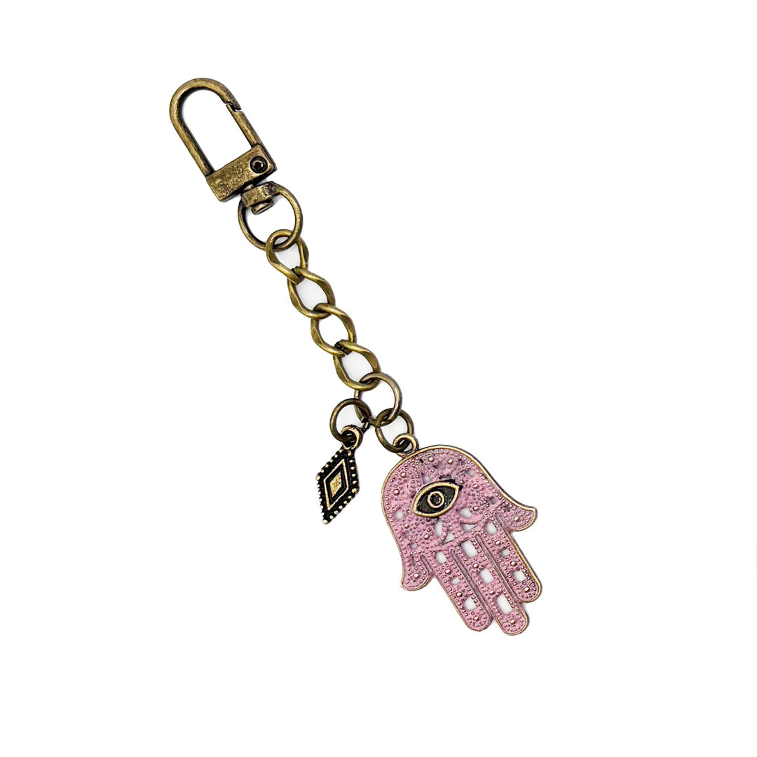 Hand-painted hamsa talisman bag charm and keychain with lobster claw, 4.5 inches long, hypoallergenic, supports Global Fund for Women.
