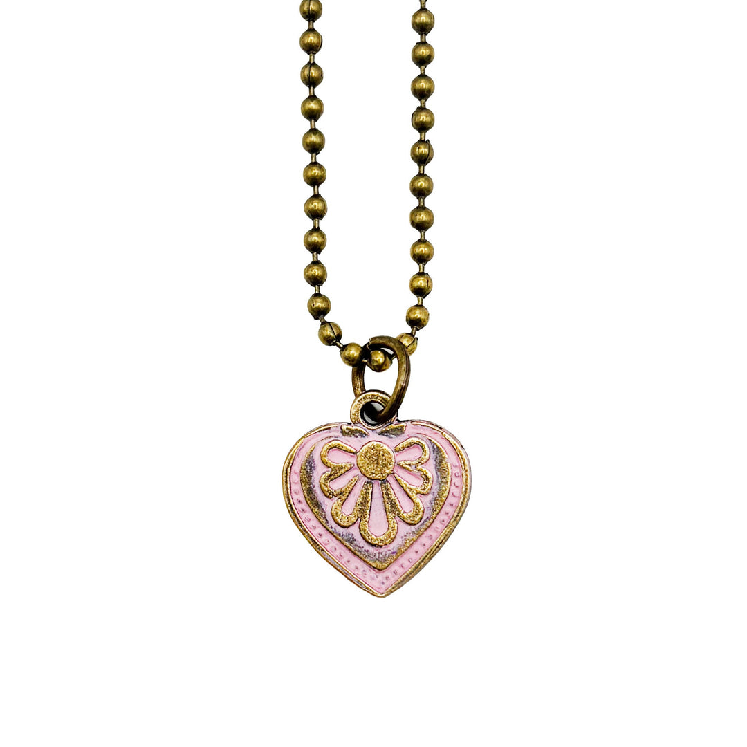 Antique bronze charm painted pink and burnished to shiny gold. Graphic details mimic a blooming flower. Shown on an 18" antique bronze ball chain.