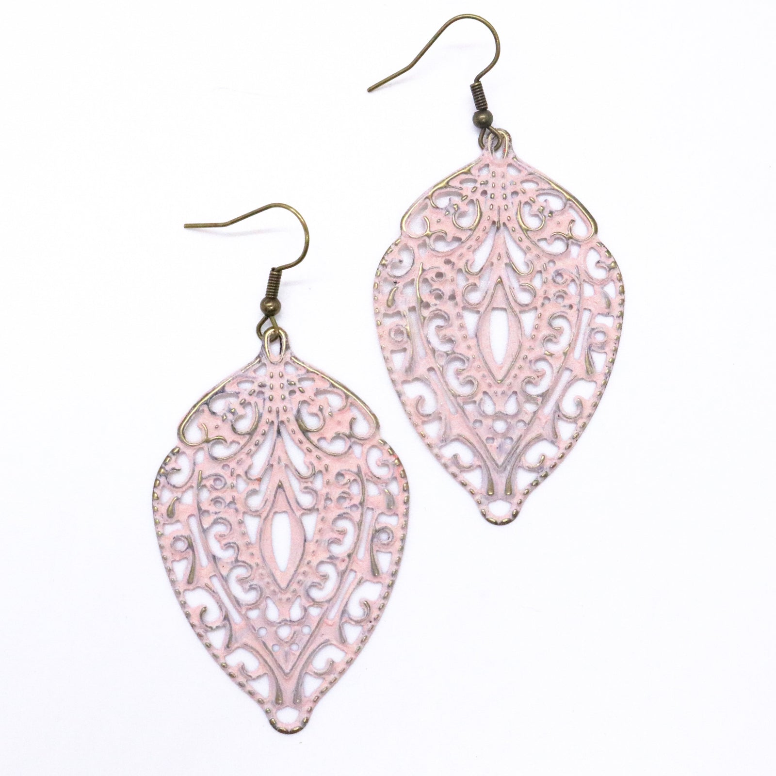 Antique bronze filigree charms painted light pink and burnished to shiny gold. 1" antique bronze ear hooks. Vintage and bohemian appeal.