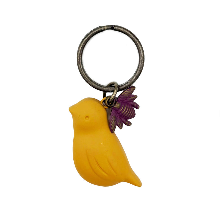 Antique bronze 1 1/2" bird charm with small bee charm keychain on 1 1/4" keyring. Yellow bird with purple bee charm.