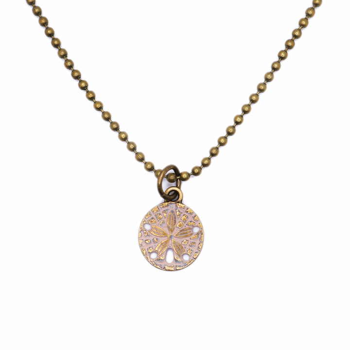 Sand Dollar Charm, 5/8” long, available as Charm on Card, 7 1/2” brass hook bangle bracelet, or 18” antique bronze ball chain necklace, hand-painted in Denver, CO, hypoallergenic.